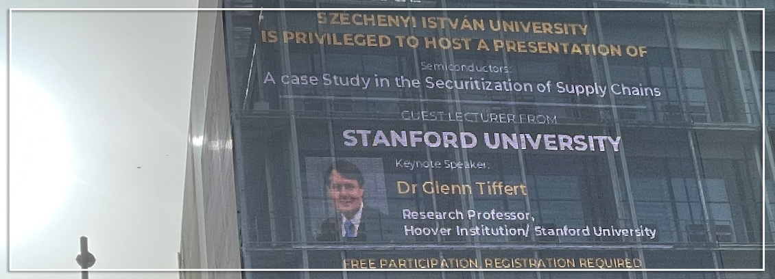 A presentation featuring CGSP cochair and Hoover Institution distinguished research fellow Glenn Tiffert is advertised on the side of a building in Gyor, Hungary.