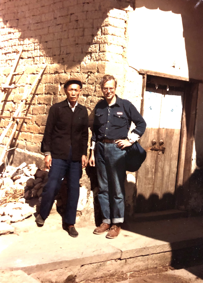 Photo of J. Kenneth Olenik (right) with a descendant of Deng Yanda in front of Deng’s historic home in Huiyang, Guangdong Province.
