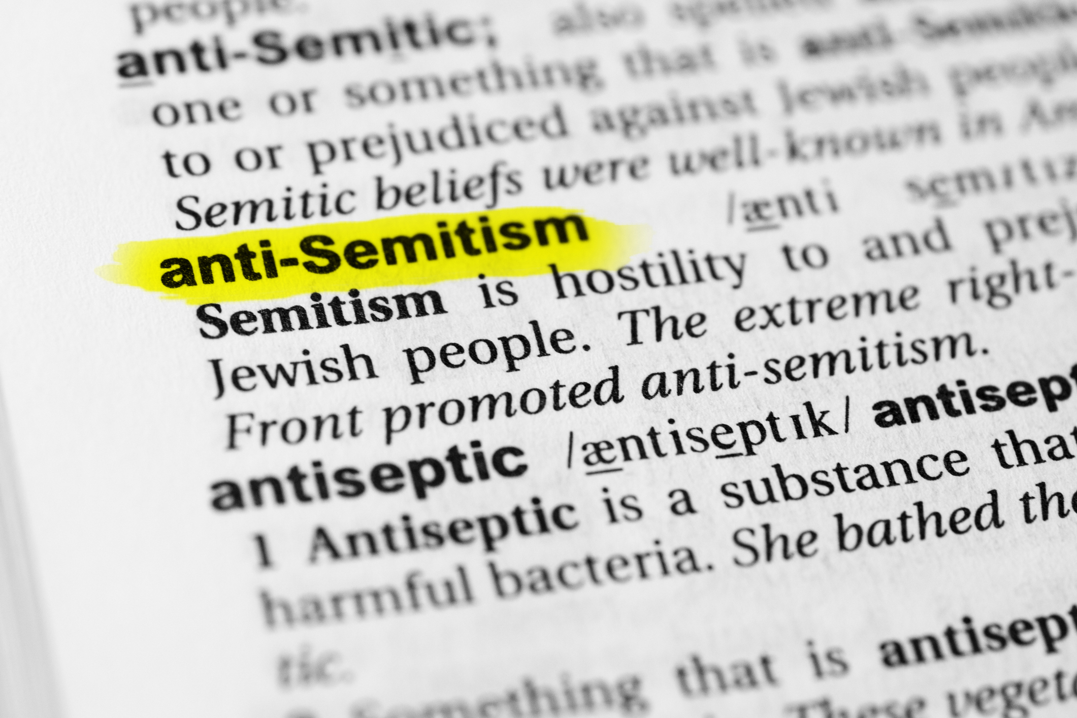 Highlighted English word "anti semitism" and its definition in the dictionary - stock photo