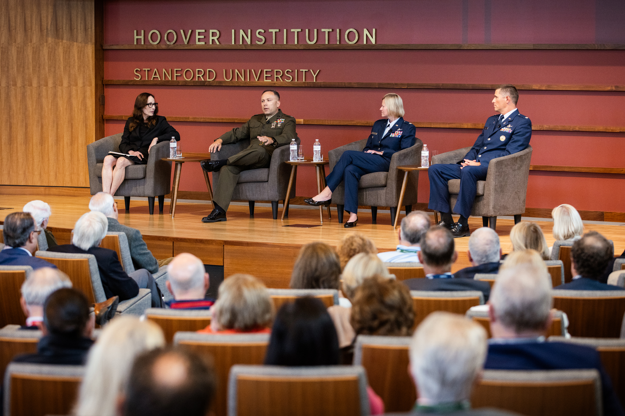 Amy Zegart, Lt. Col. Leo Spaeder, Lt. Col. Katherine Onstad, and Lt. Col. Patrick Gaynor speak about the National Security Affairs Fellowship on October 9, 2025. (Patrick Beaudouin)