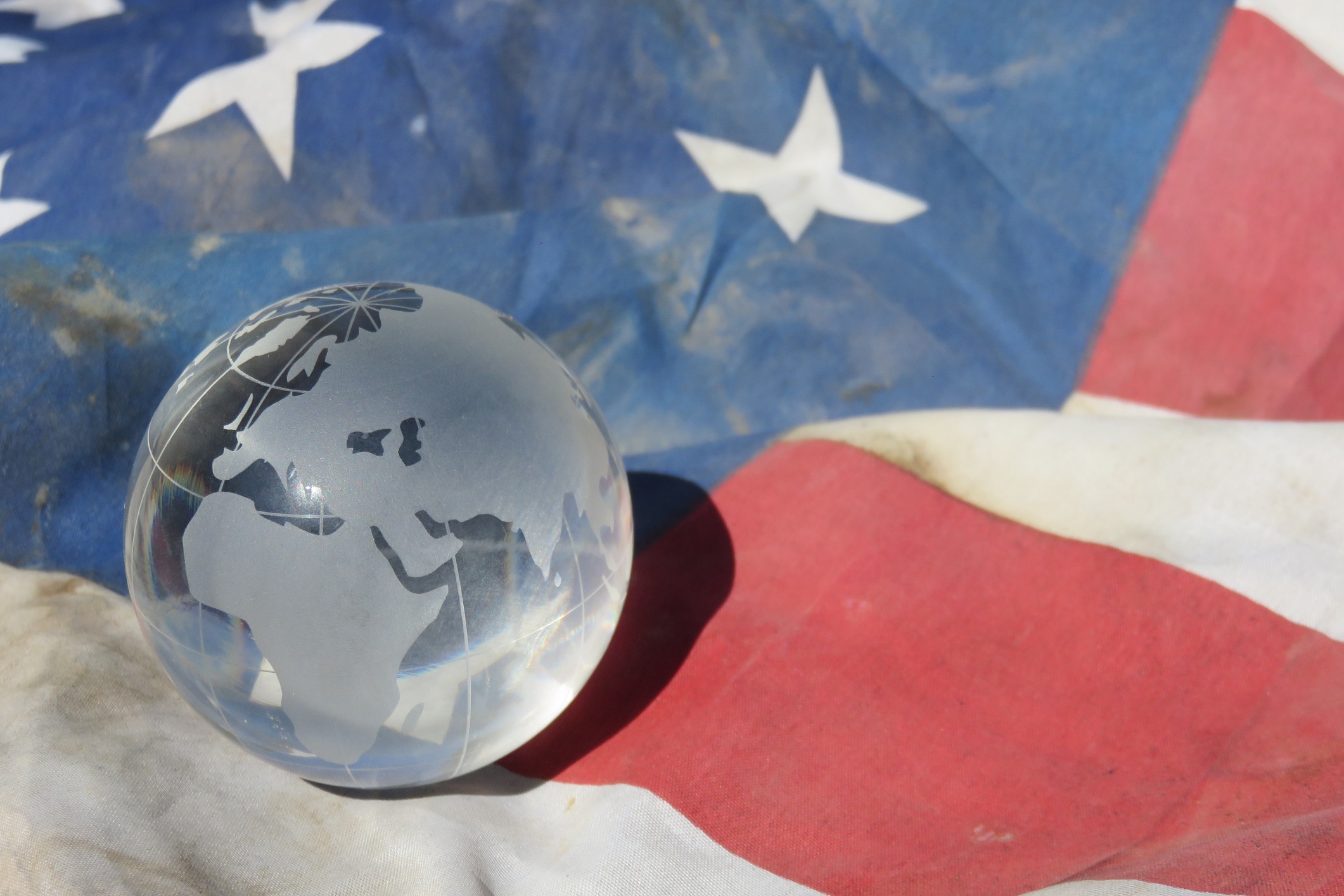 Globe on top of an American Flag