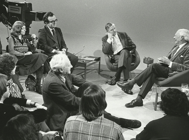 Black and white photograph of William F. Buckley and some audience members on the set of Firing Line