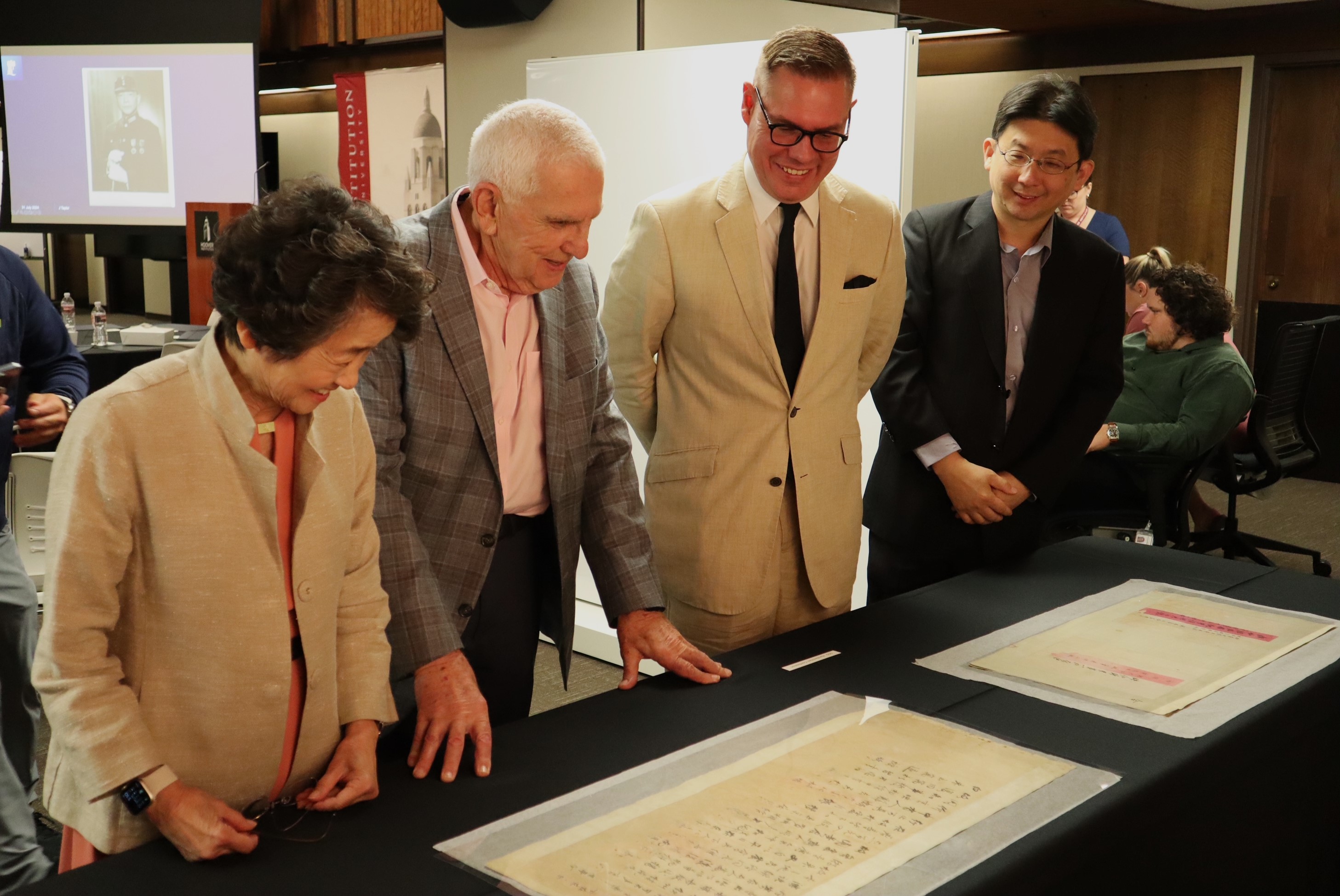 Jeremy Taylor (University of Nottingham, second from the right) reviews invaluable historical materials from the Wang Jingwei Collection with Wang’s granddaughter Christina Wang (left) and her husband Ronald Swerdloff (second from the left).