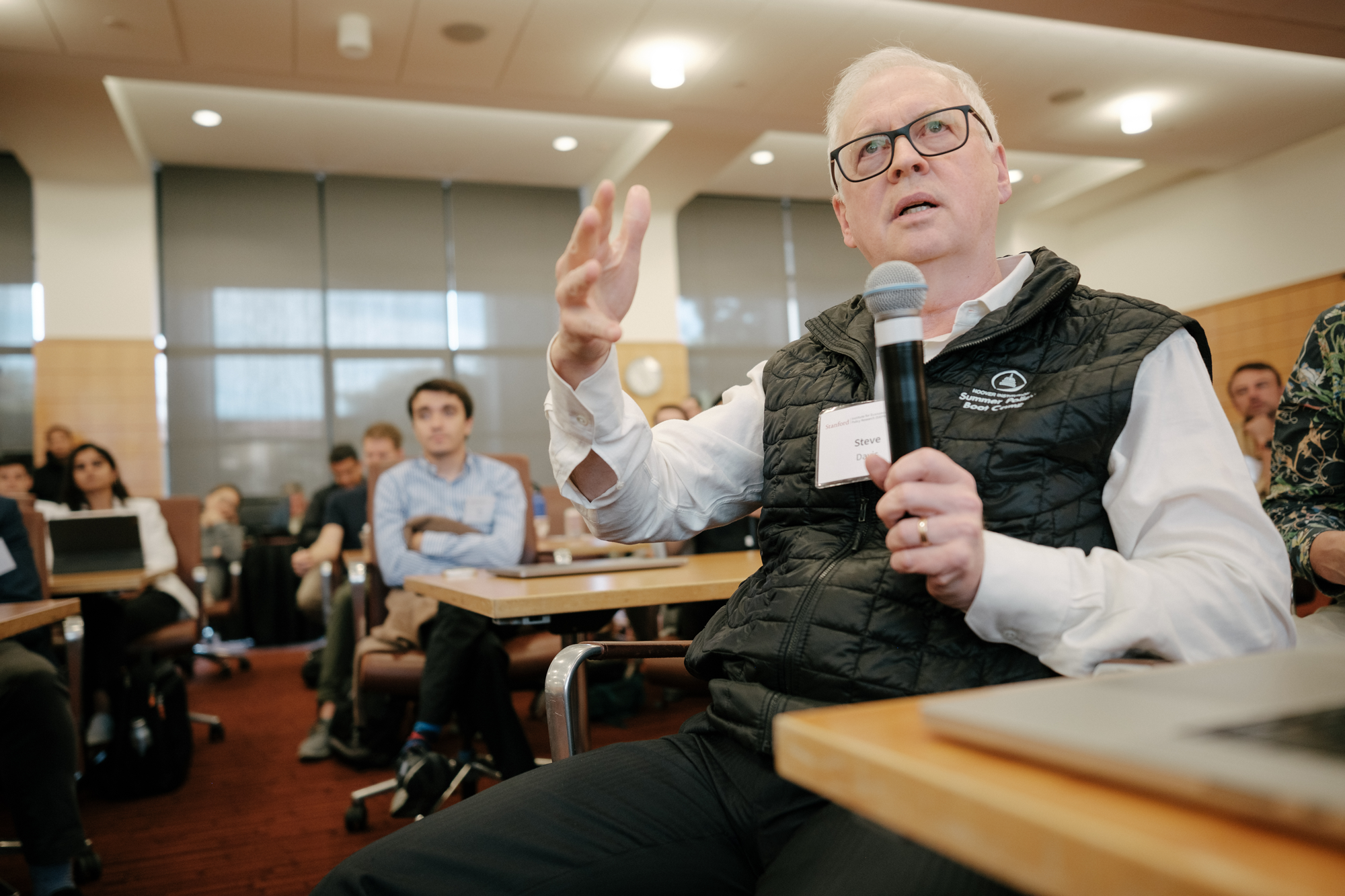 Hoover Institution Senior Fellow and Research Director Steven J. Davis asks a presenter at question at the Implications of Remote Work Conference on October 9, 2024. (Ryan Zhang) 