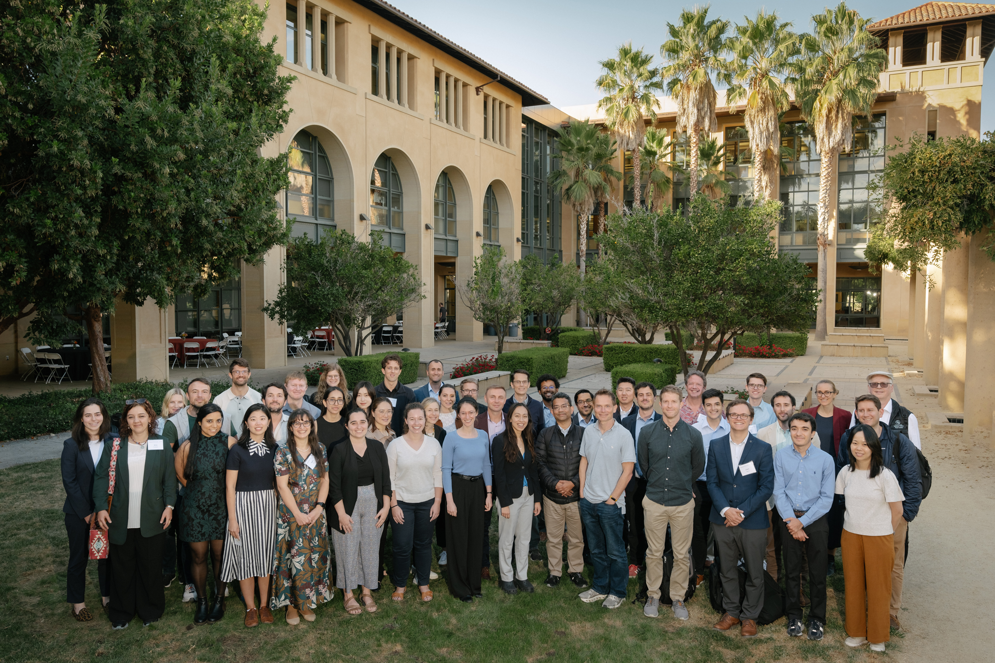 Participants in the 2024 Implications of Remote Work Conference pose in front of Stanford’s Institute for Economic Policy Research (SIEPR) on October 9, 2024. (Ryan Zhang)