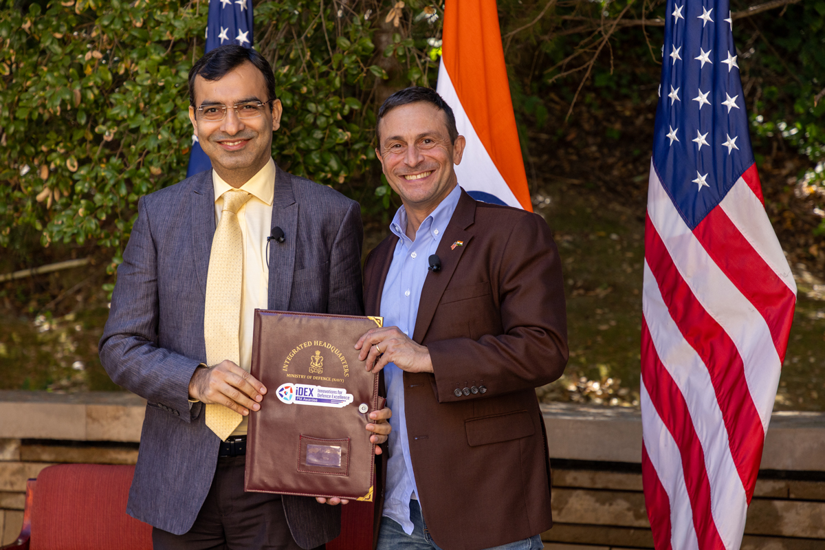 Amit Satija, Joint Secretary of Defense Production for India’s Ministry of Defense, and Doug Beck, Director of the US Defense Innovation Unit, hold a memorandum of understanding they signed at the INDUS-X Summit at Stanford on September 10, 2024. (US-India Strategic Partnership Forum)