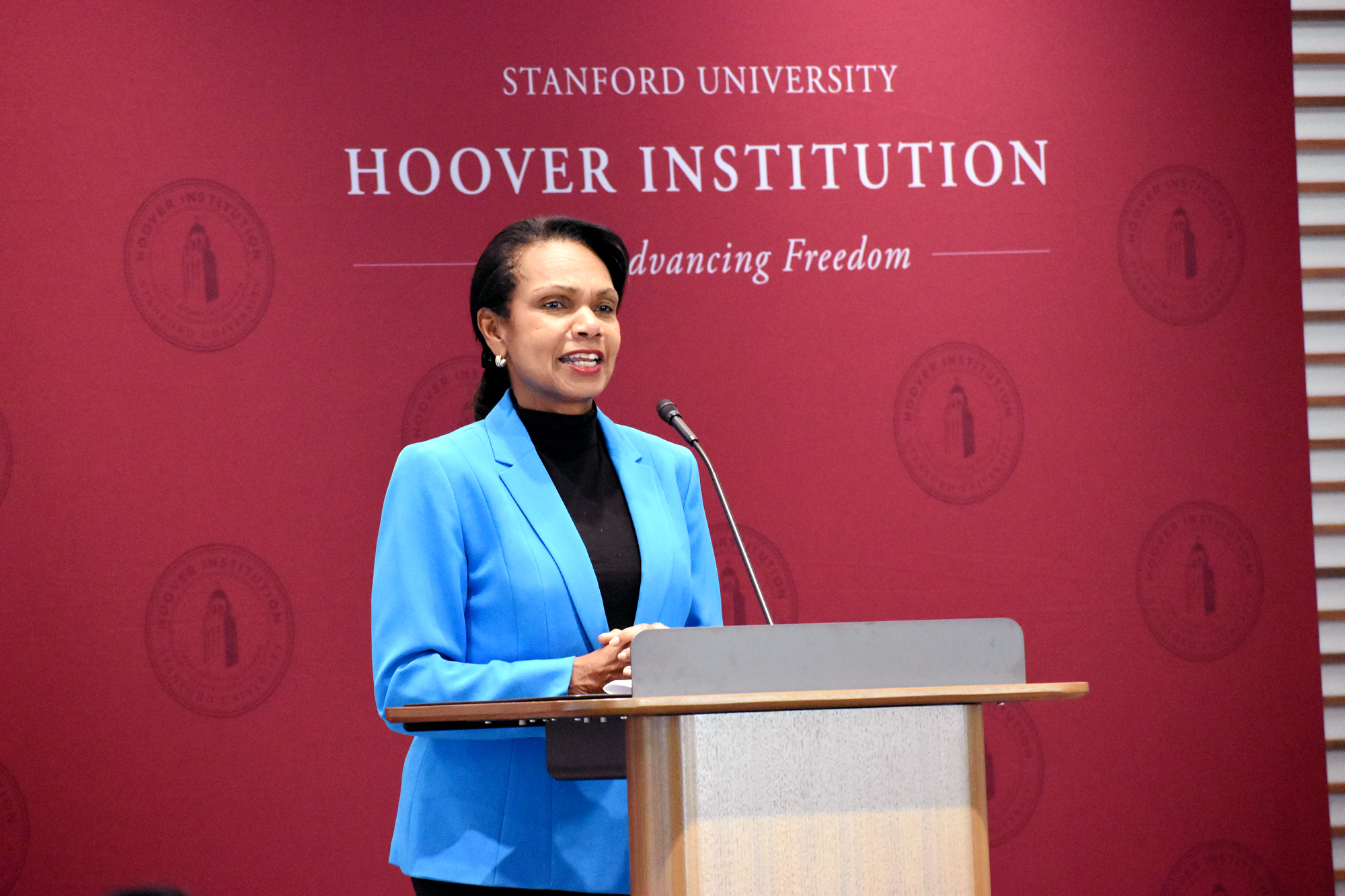 Hoover Institution Director Condoleezza Rice addresses winners of the Distinguished Undergraduate Essay Competition and their families in the Shultz Auditorium on October 15, 2024. 