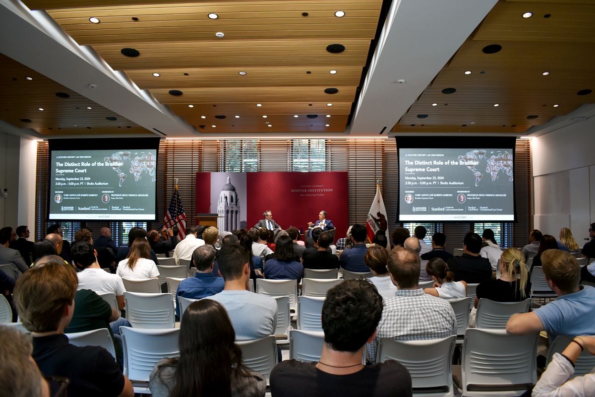 Attendees listen to Brazilian Supreme Federal Court President Justice Luís Roberto Barroso speak to Insper São Paulo’s Diego Werneck Arguelhes at the Hoover Institution on September 23, 2024. 