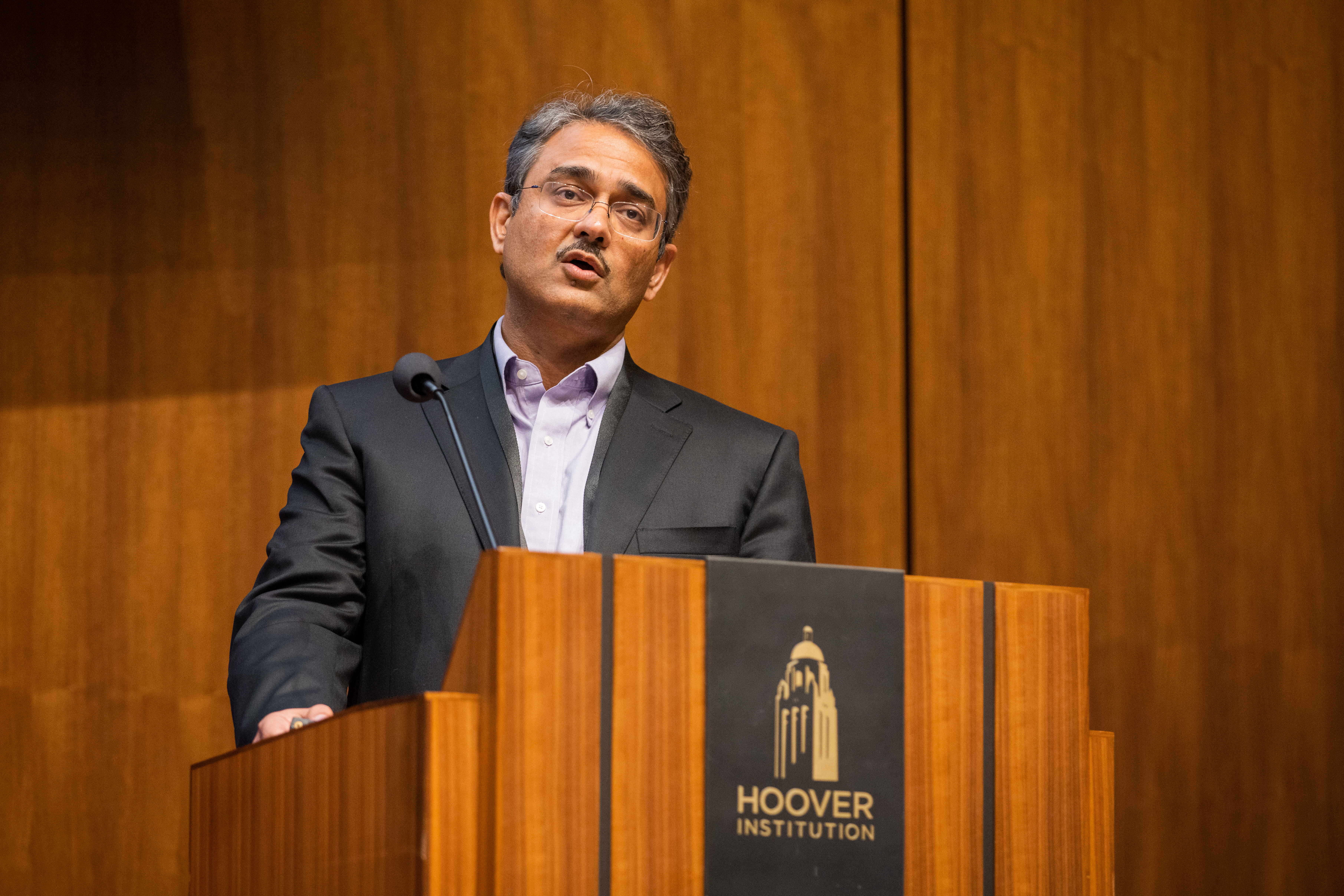 Senior Fellow Amit Seru speaks about bank risk at the Monetary Policy Conference in Hauck Auditorium on May 3, 2024. (Patrick Beaudouin)