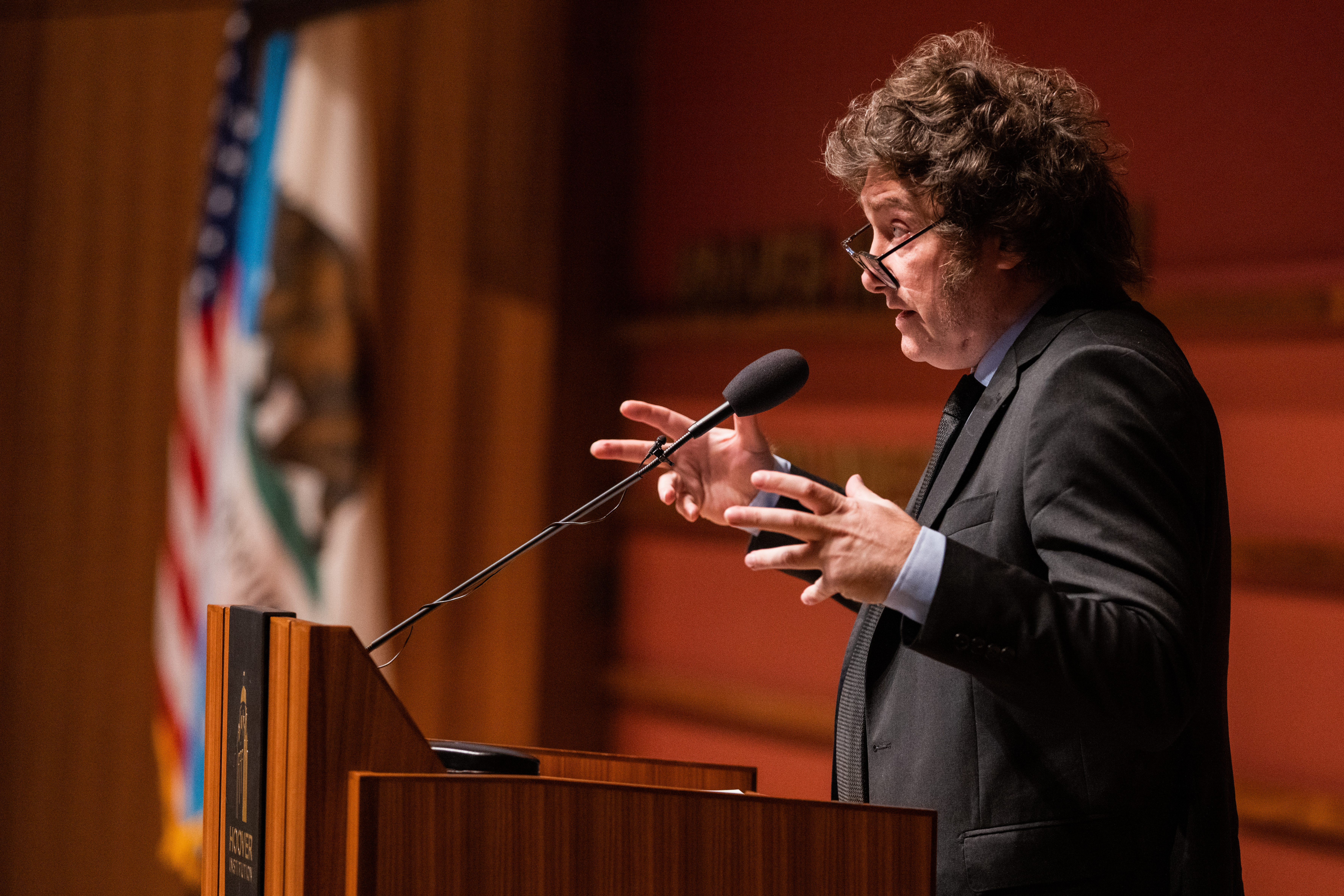 Argentine president Javier Milei gestures at the podium as he speaks in Hauck Auditorium on May 29, 2024.