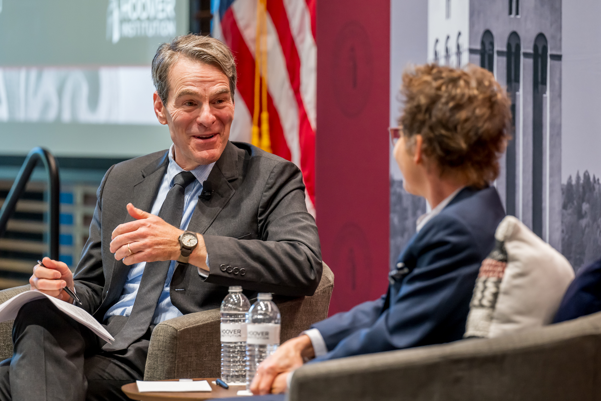 Senior Fellow John H. Cochrane speaks with SF Fed President and CEO Mary C. Daly in Shultz Auditorium on December 6, 2024. (Steve Castillo)