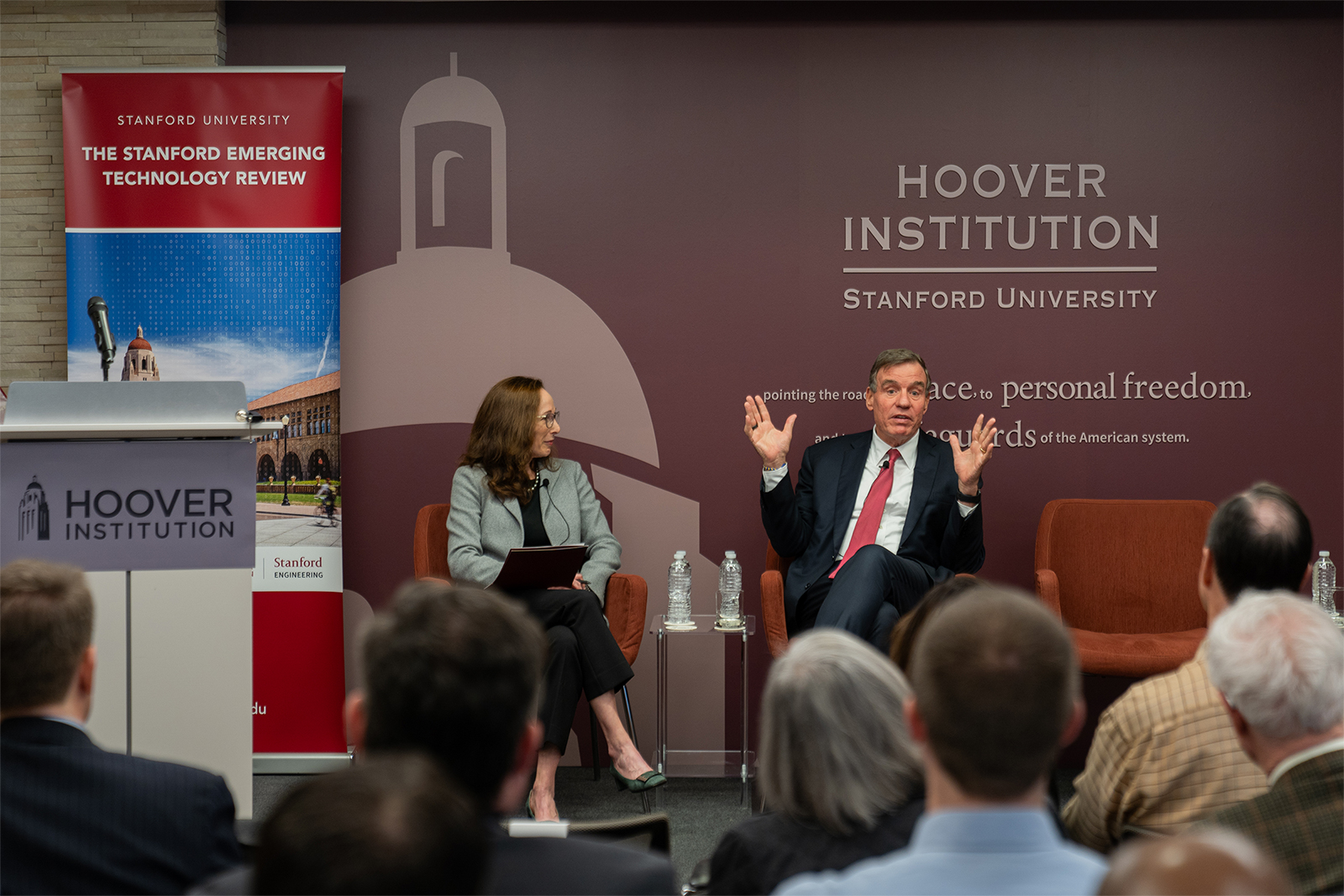 Senator Mark Warner (Virginia), chairman of the Senate Intelligence Committee, joins in conversation with Senior Fellow Amy Zegart at the launch of the Stanford Emerging Technology Review in Washington, DC, on January 25.