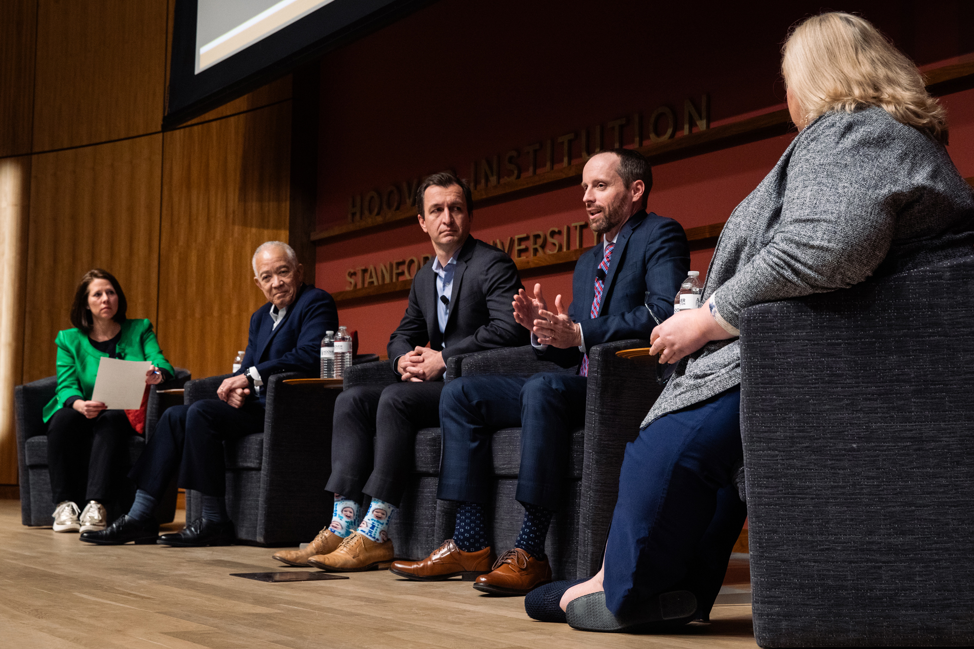 Jenn Vranek of Education First Consulting South Carolina teacher Patrick Kelly, Evan Stone, CEO of Educators for Excellence and Houston Schools superintendent Mike Miles speak about the teaching profession in Hauck Auditorium. (Patrick Beaudoin)