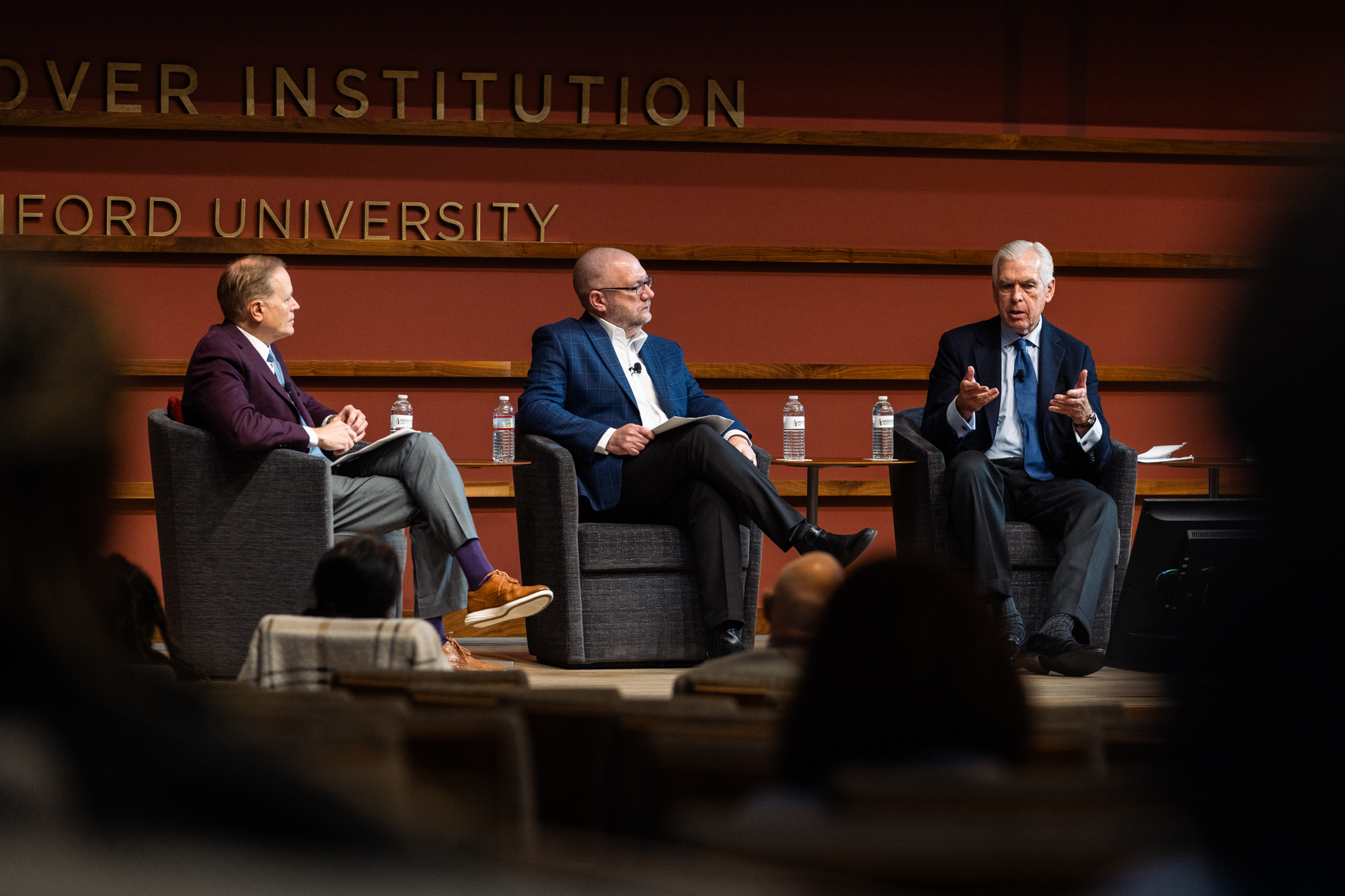 Jim Peyser, former Massachusetts secretary of education, Jeremy Tucker, superintendent of Liberty Public Schools in Missouri and Philip K. Howard, chair of Common Good, speak about education system reform in Hauck Auditorium on January 10, 2025. (Patrick Beaudouin)