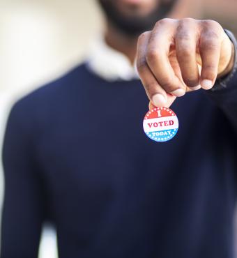 Young Black Man with I voted Sticker stock photo