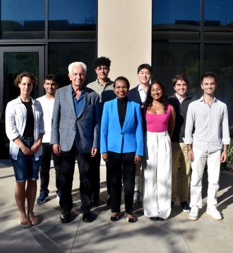 Hoover Institution Director Condoleezza Rice and Senior Fellow Russell A. Berman stand with winners of the Distinguished Undergraduate Essay Competition outside the Shultz Building on October 15, 2024.