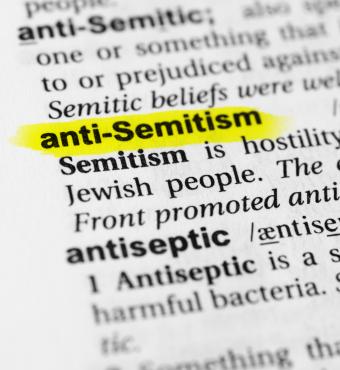 Highlighted English word "anti semitism" and its definition in the dictionary - stock photo