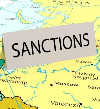 Card that says "sanctions" on a map of Russia