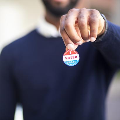 Young Black Man with I voted Sticker stock photo