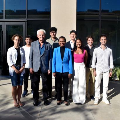 Hoover Institution Director Condoleezza Rice and Senior Fellow Russell A. Berman stand with winners of the Distinguished Undergraduate Essay Competition outside the Shultz Building on October 15, 2024.