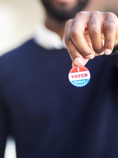 Young Black Man with I voted Sticker stock photo