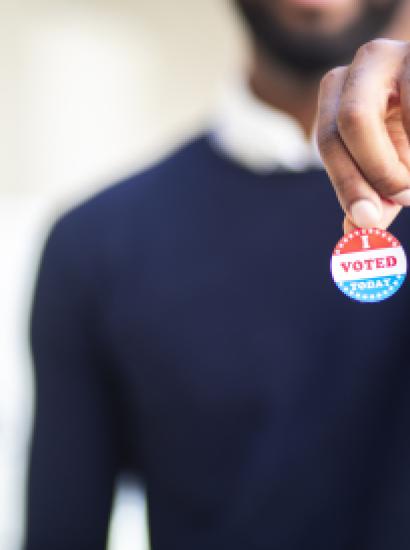 Young Black Man with I voted Sticker stock photo