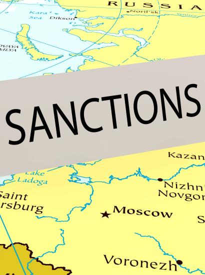 Card that says "sanctions" on a map of Russia