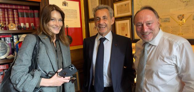 Carla Bruni, former French president Nicholas Sarkozy and Andrew Roberts are seen in London on June 4.