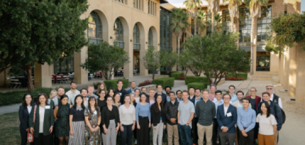 Participants in the 2024 Implications of Remote Work Conference pose in front of Stanford’s Institute for Economic Policy Research (SIEPR) on October 9, 2024. (Ryan Zhang)