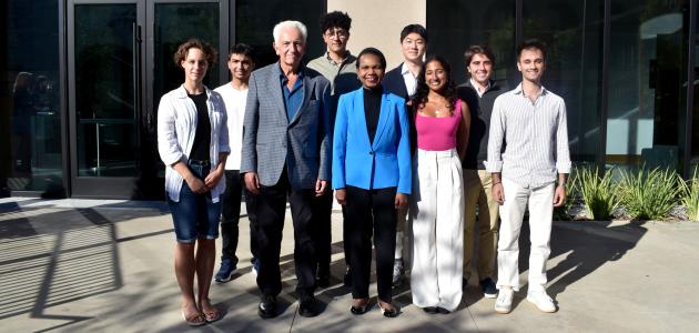 Hoover Institution Director Condoleezza Rice and Senior Fellow Russell A. Berman stand with winners of the Distinguished Undergraduate Essay Competition outside the Shultz Building on October 15, 2024.