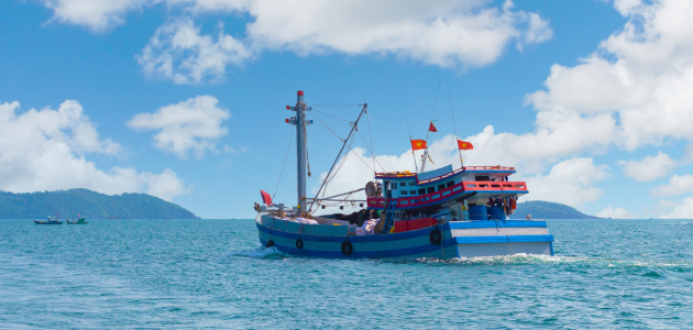 Vietnamese fisherman boat stock photo