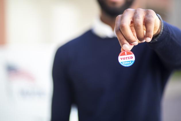 Young Black Man with I voted Sticker stock photo