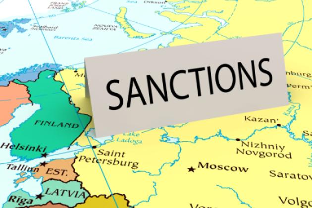 Card that says "sanctions" on a map of Russia