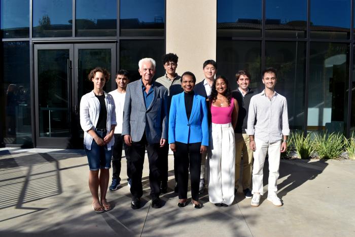 Hoover Institution Director Condoleezza Rice and Senior Fellow Russell A. Berman stand with winners of the Distinguished Undergraduate Essay Competition outside the Shultz Building on October 15, 2024.