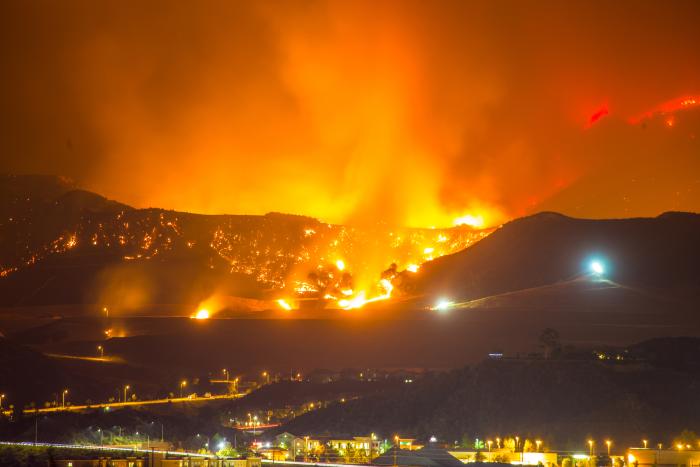 Night long exposure photograph of wildfire stock photo