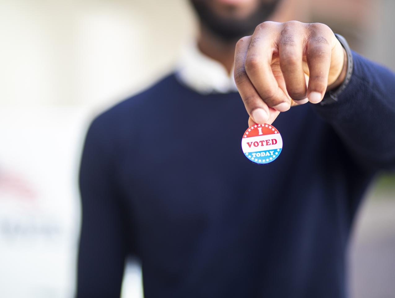 Young Black Man with I voted Sticker stock photo