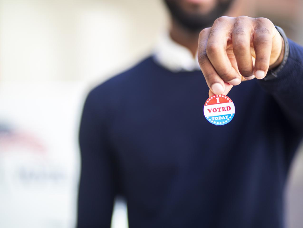 Young Black Man with I voted Sticker stock photo