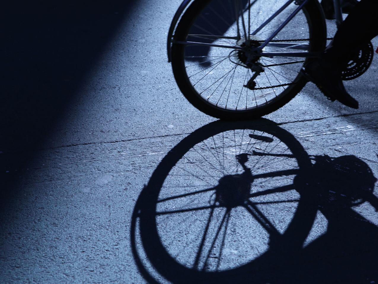 NYC cycling in blue night shadows stock photo