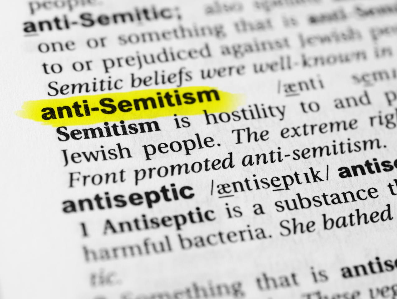 Highlighted English word "anti semitism" and its definition in the dictionary - stock photo