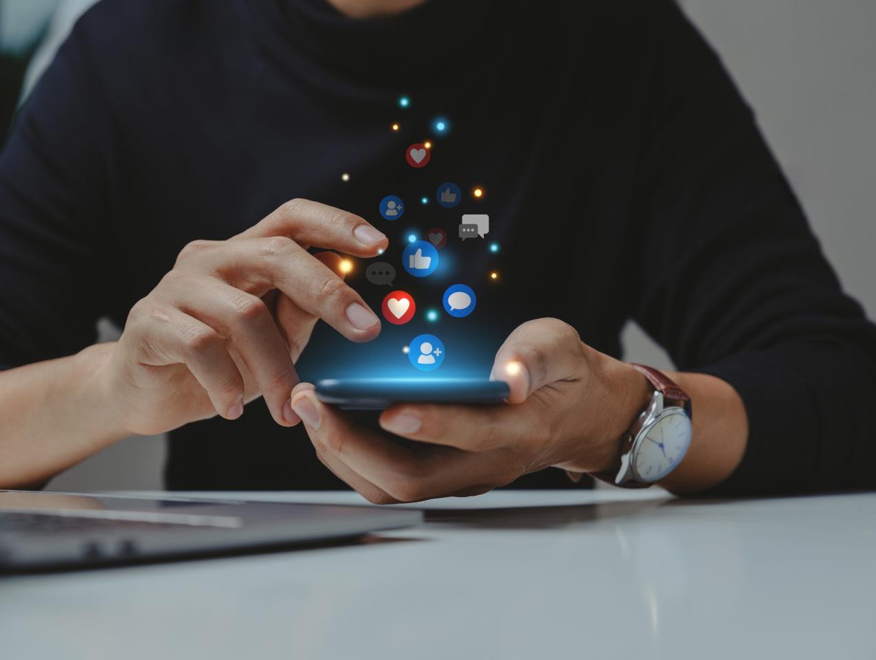 Hand of young business using smartphone. stock photo