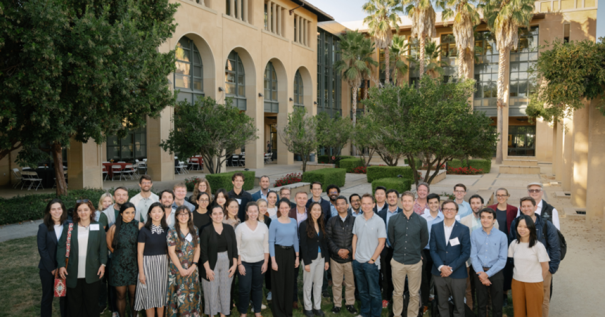 Participants in the 2024 Implications of Remote Work Conference pose in front of Stanford’s Institute for Economic Policy Research (SIEPR) on October 9, 2024. (Ryan Zhang)