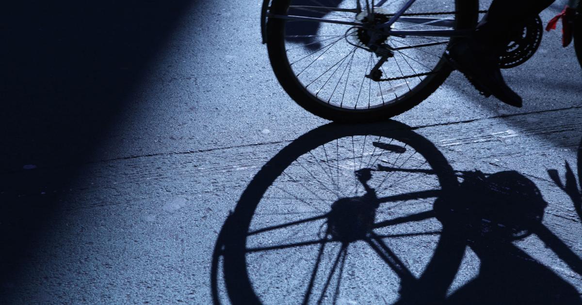 NYC cycling in blue night shadows stock photo