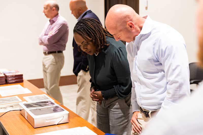 Mary L. Tobin and Col. Michael Arnold, members of the Hoover Bochnowski Family Veteran Fellowship Program, view X-ray images of Adolf Hitler’s skull (William Russell Philp Collection) in June 2024.