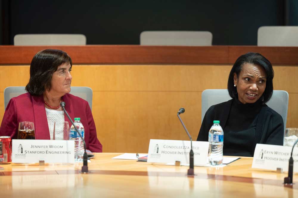 Stanford Emerging Technology Review cochairs Jennifer Widom (left) and Director Condoleezza Rice attend a roundtable on December 8, 2023.