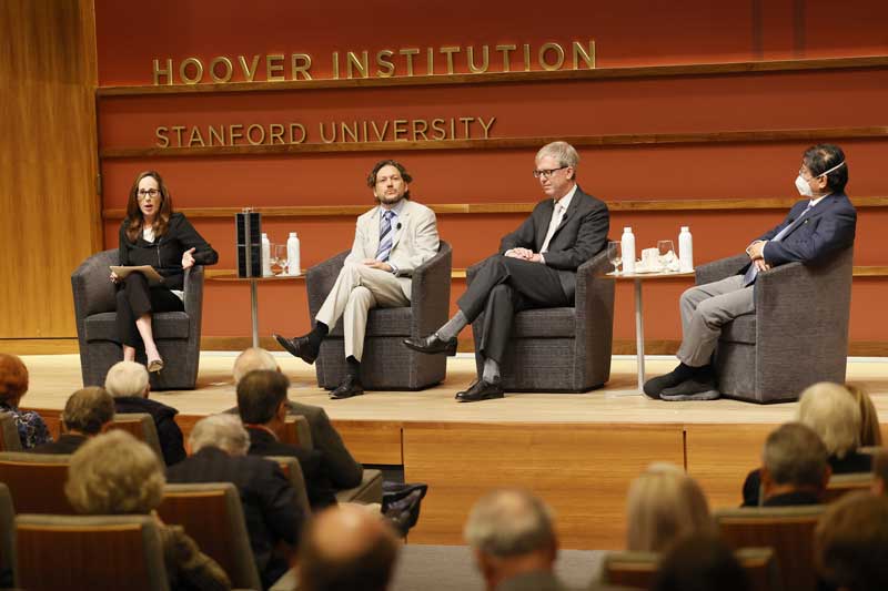 Senior Fellow Amy Zegart leads a discussion about the Stanford Emerging Technology Review with science fellows (left to right) Simone D’Amico and Drew Endy and the initiative’s director, Fellow Herb Lin at the 2023 Fall Retreat.